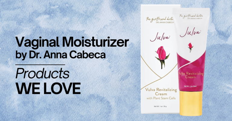 A promotional image featuring 'Vaginal Moisturizer by Dr. Anna Cabeca' on a light blue watercolor background. The image shows a tube and box of 'Julva Vulva Revitalizing Cream with Plant Stem Cells,' branded with a pink rose logo. The text on the left side of the image reads 'Vaginal Moisturizer by Dr. Anna Cabeca' in large black letters, followed by 'Products WE LOVE' in smaller black letters.