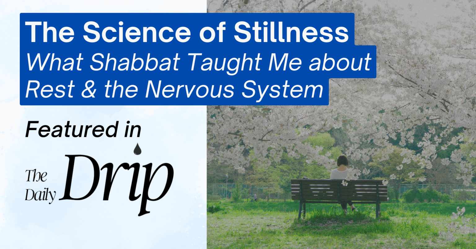 A person sits on a bench in a serene park with blooming cherry blossom trees in the background. The image includes a blue text overlay on the left side that reads: "The Science of Stillness" at the top, followed by "What Shabbat Taught Me about Rest & the Nervous System" in larger text. Below that, in smaller text, it says "Featured in" with "The Daily Drip" in a stylized font, accompanied by a drip icon.